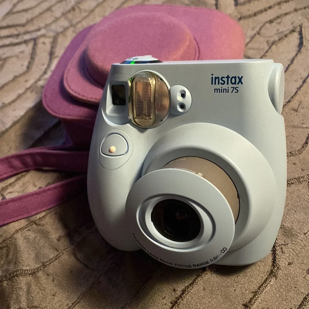 Blue instax camera with purple case